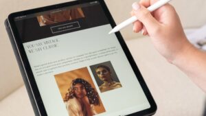 A person works on an iPad and demonstrates creative branding.